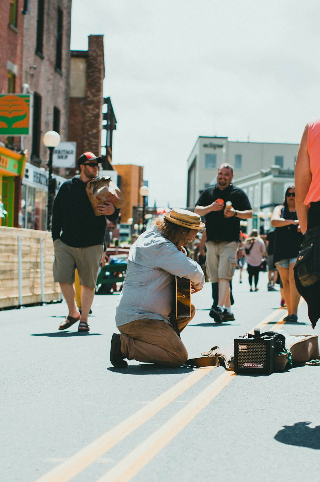 Camera crew filming a live report on a street with a reporter
